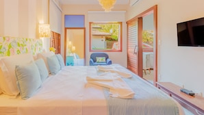 A hotel room with a large bed, a television, a chair, and a window with a view of the outside. -  PF41 House 6 Bedrooms 300m from the Sea (Mata de São João)