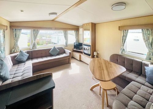 Spacious 12ft-wide family caravan with one double and one twin.