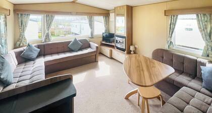 Spacious 12ft-wide family caravan with one double and one twin.