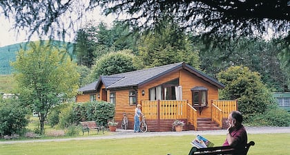 Log cabin with one double with en suite shower and two twin.