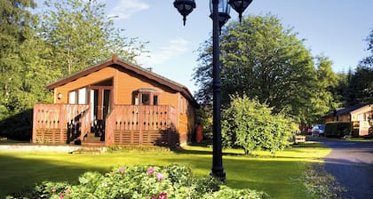 Log cabin with one double with en suite shower and two twin.