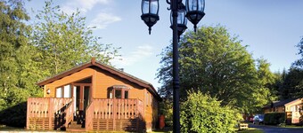 Log cabin with one double with en suite shower and two twin.