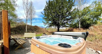 Modern and contemporary lodge style holiday home set in woodland area.