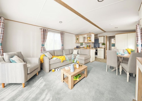 Stylish and modern caravan with one double and two twin.