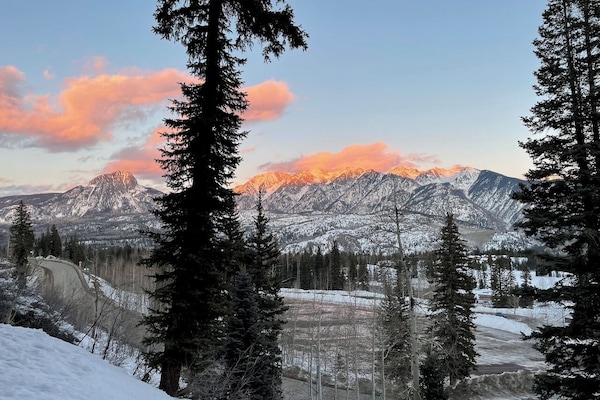 The view. As the sun sets, the shadows climb the mountains.