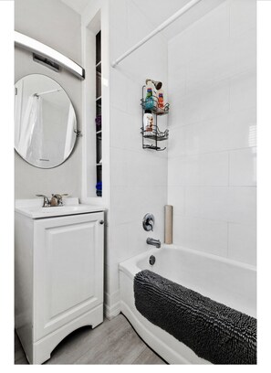 Combined shower/tub, hair dryer, towels, soap