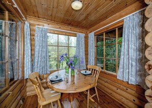 Dining - Timber lodge set in an elevated position with views of the lake. (Webbery, Bideford)