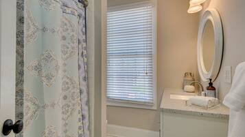 Combined shower/bathtub, hair dryer, towels, soap