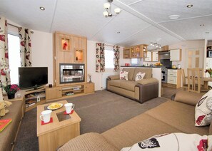 Living area - Top of the range 12ft-wide caravan with one double and two twin. (Burnham-on-Sea)