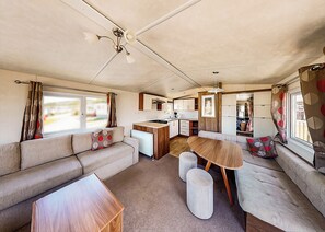 Living area - Well presented 12ft-wide caravan with one double and one twin. (Perranporth)