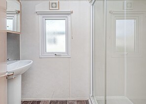 Bathroom - 12ft-wide quality caravan with one double and two twin. (Rhyl)