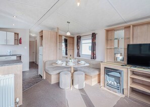 Unclassified image, 5 of 12, button - 12ft-wide quality caravan with one double and two twin. (Rhyl)