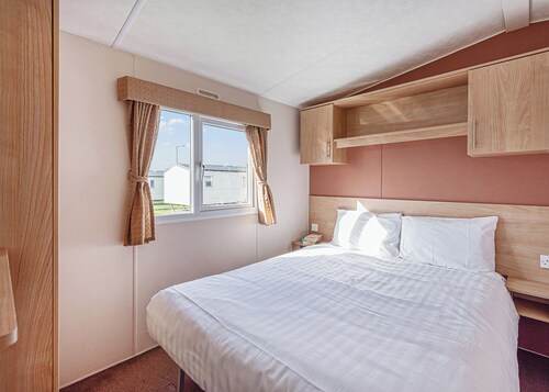 12ft-wide quality caravan with one double and two twin.