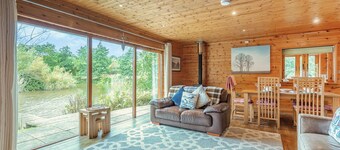 Ground floor: Spacious open plan lounge, kitchen, dining area with log burner.