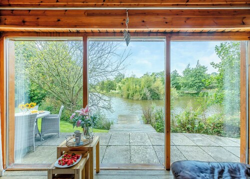 Ground floor: Spacious open plan lounge, kitchen, dining area with log burner.