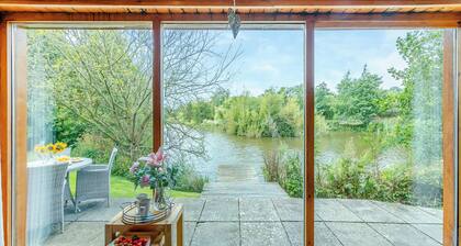 Ground floor: Spacious open plan lounge, kitchen, dining area with log burner.