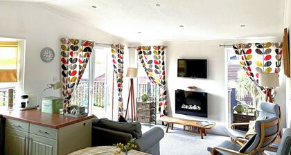 Spacious lodge with one master double and two twin.