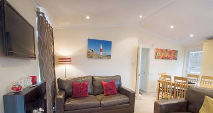 Spacious lodge with one master double and two twin.