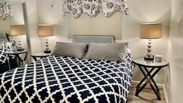 1 bedroom, desk, iron/ironing board, travel crib