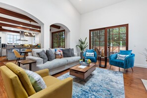 Smart TV, fireplace, books, computer monitors