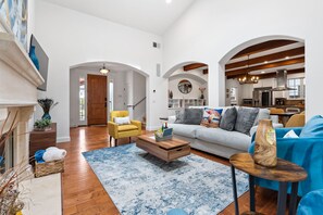 Smart TV, fireplace, books, computer monitors