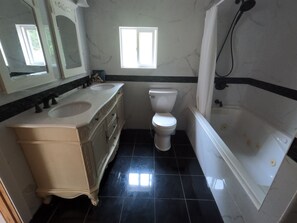 Combined shower/tub, hair dryer, towels, soap