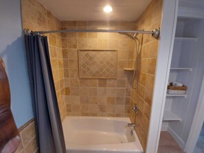Combined shower/bathtub, hair dryer, towels, soap