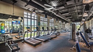 A gym with treadmills, weight machines, and exercise balls. - 1804 Tropical Palms Circle (Kissimmee)