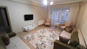 Condo Confort | Área de sala de estar | Televisión LCD, Netflix, películas de estreno y servicios de streaming