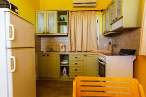 Fridge, dishwasher, coffee/tea maker, dining tables