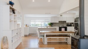 Stovetop, dishwasher, coffee/tea maker, dining tables