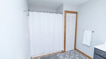 Combined shower/tub, hair dryer, towels, toilet paper
