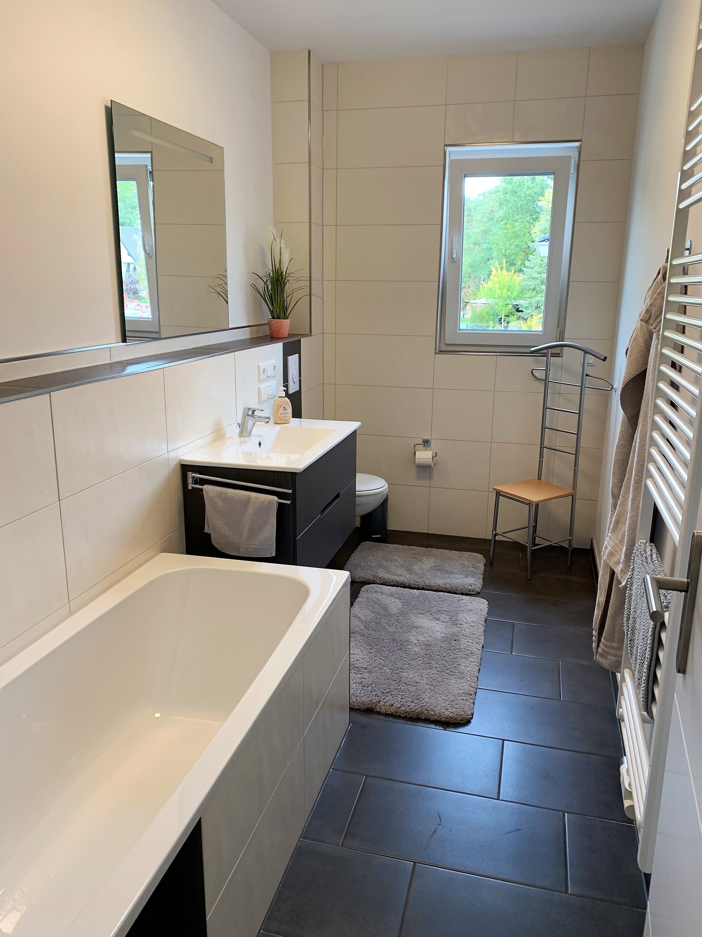 Bathtub, towels, toilet paper