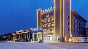 A hotel with a modern facade, multiple floors, and a prominent entrance. - Chizhou Amethyst Hotel (Chizhou)