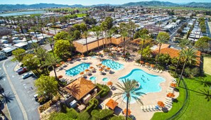 3 outdoor pools, pool umbrellas, pool loungers - The Cottages at Golden Village Palms RV Resort (Hemet)