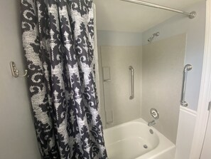 Combined shower/bathtub, hair dryer, towels, soap