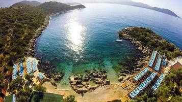 On the beach, sun loungers, beach towels