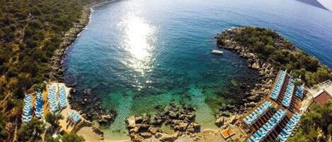 On the beach, sun loungers, beach towels