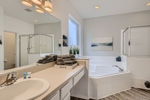Combined shower/tub, hair dryer, towels, soap