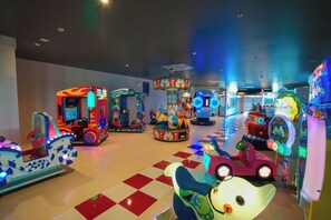 An indoor amusement arcade with various rides and games. - Mikazuki Villas - The Ryokan (Da Nang)