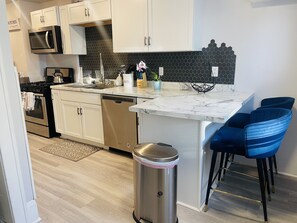 Fridge, microwave, oven, stovetop - Spacious 3BR Duplex Near Downtown St Paul, 65” TV, Parking, Work Space (Saint Paul)
