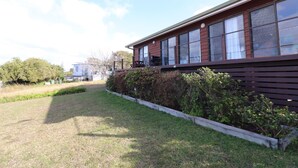 A building with large windows and a balcony. - 37 Brady Street Mallacoota (Mallacoota)