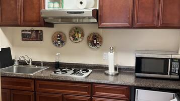 Fridge, microwave, stovetop, coffee/tea maker