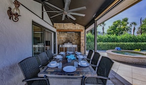 Outdoor dining - Elegant 4BR Pool Home + Guest House | Walk to Beach (Naples)