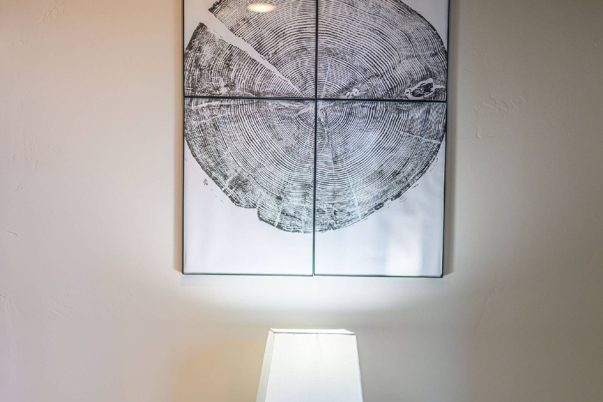 A wall-mounted artwork with a circular pattern.