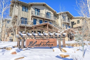 A multi-story building with a sign that reads 'Blackstone Residences.'