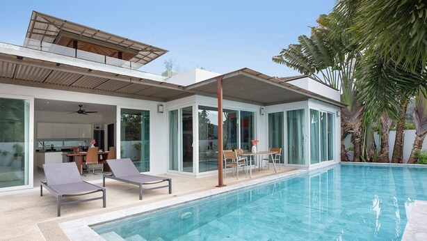 A modern house with a swimming pool, a dining area, and a kitchen. - Miami-Style 2BR Pool Villa Janine Kamala (Kamala)