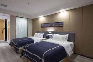 A hotel room with two beds, a nightstand, a wall-mounted TV, and a cityscape painting. - LANOU Hotel (Haiyan Science City) (Haiyan)