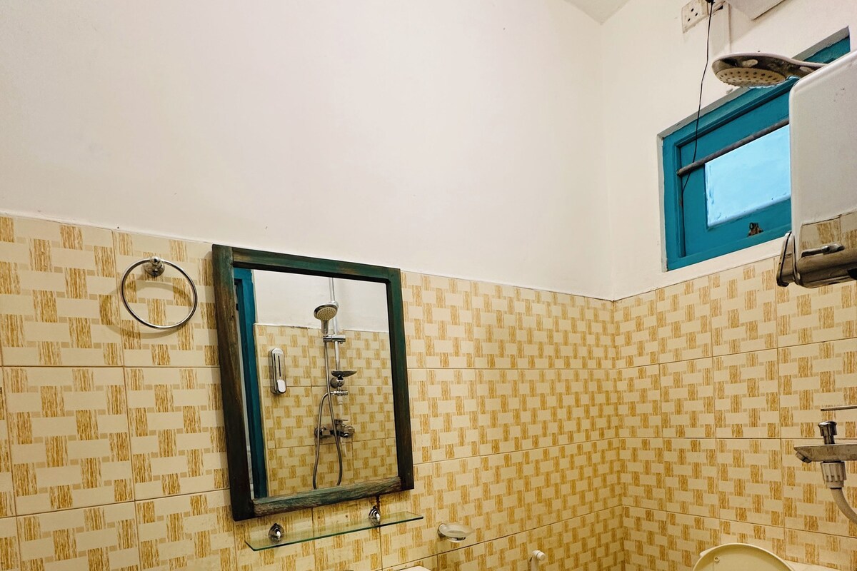 A bathroom with a sink, toilet, and shower.