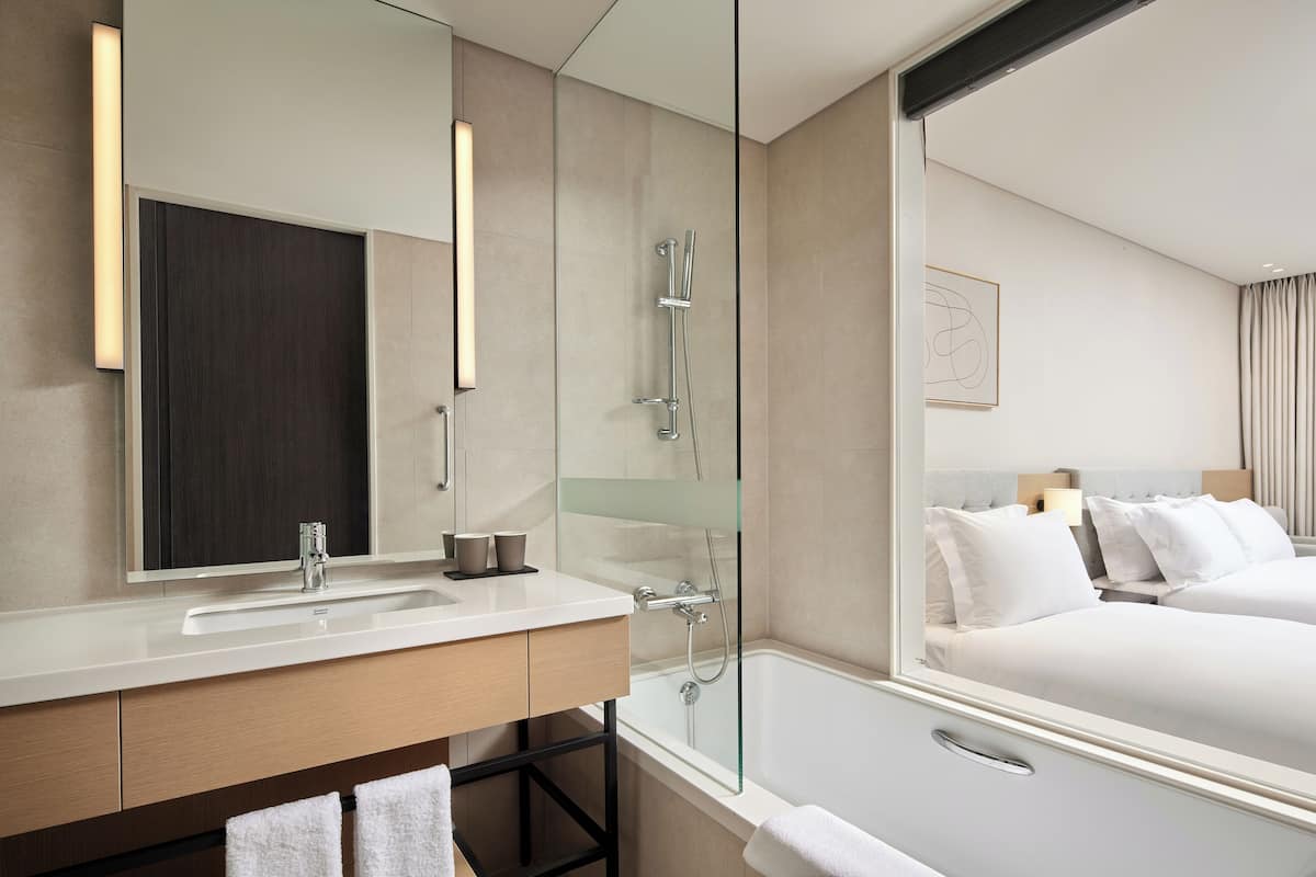 shower, hair dryer, bathrobes, slippers